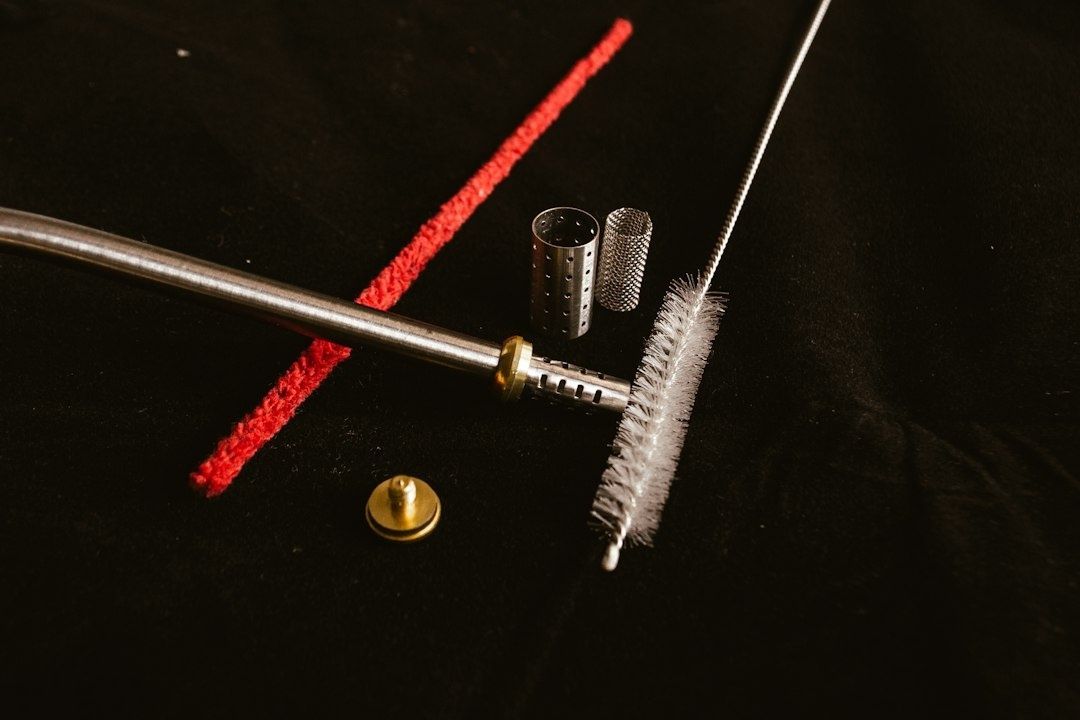 Cleaning rod, bore brush, red pull-through, and metal fittings